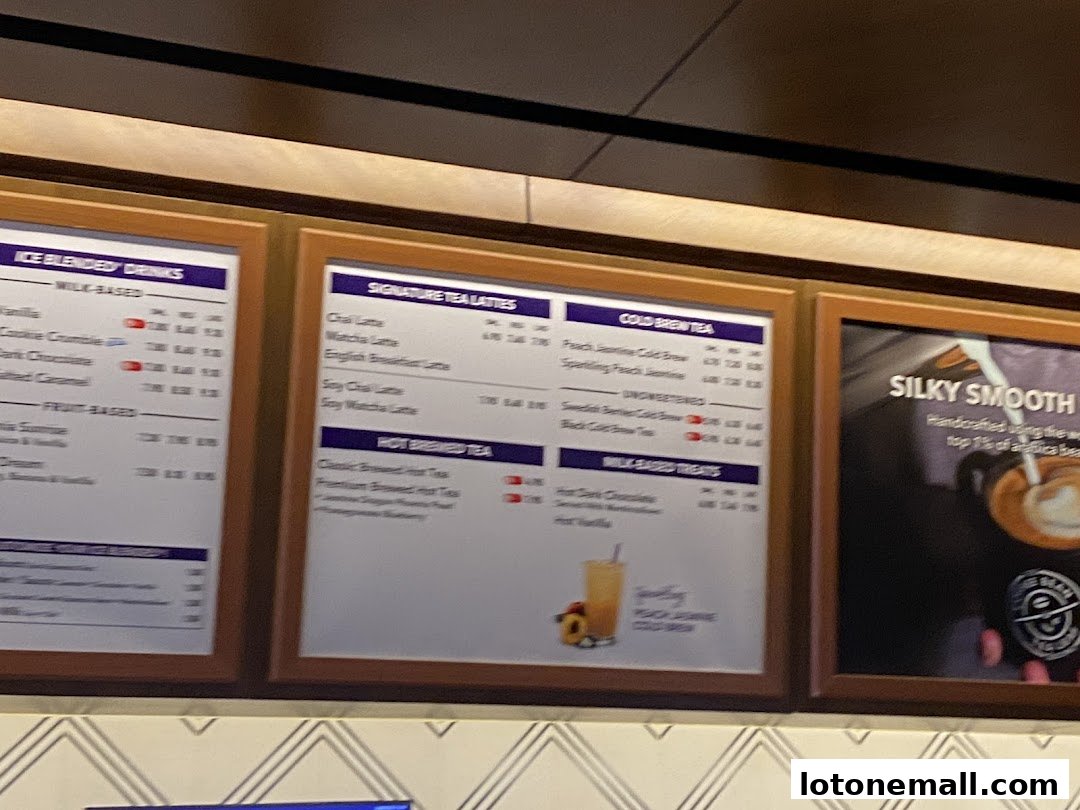 A menu board displaying various coffee and tea drinks at The Coffee Bean & Tea Leaf.