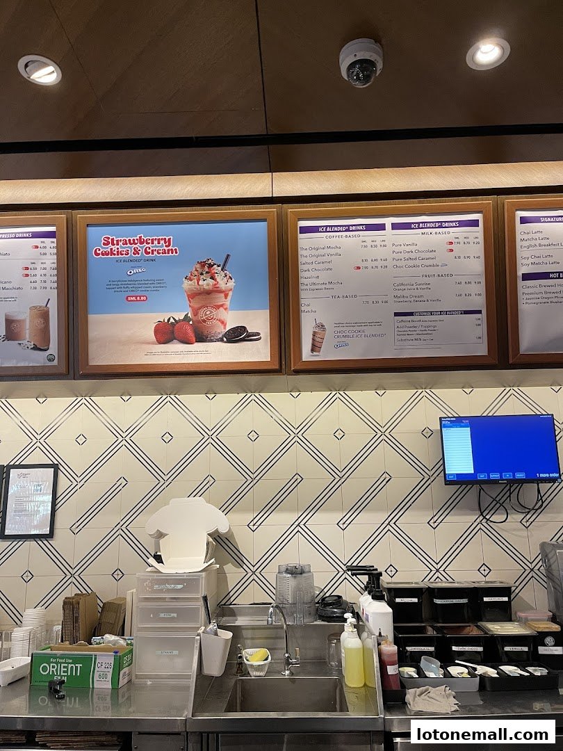 A menu board at The Coffee Bean & Tea Leaf featuring drinks like Strawberry Cookies & Cream.