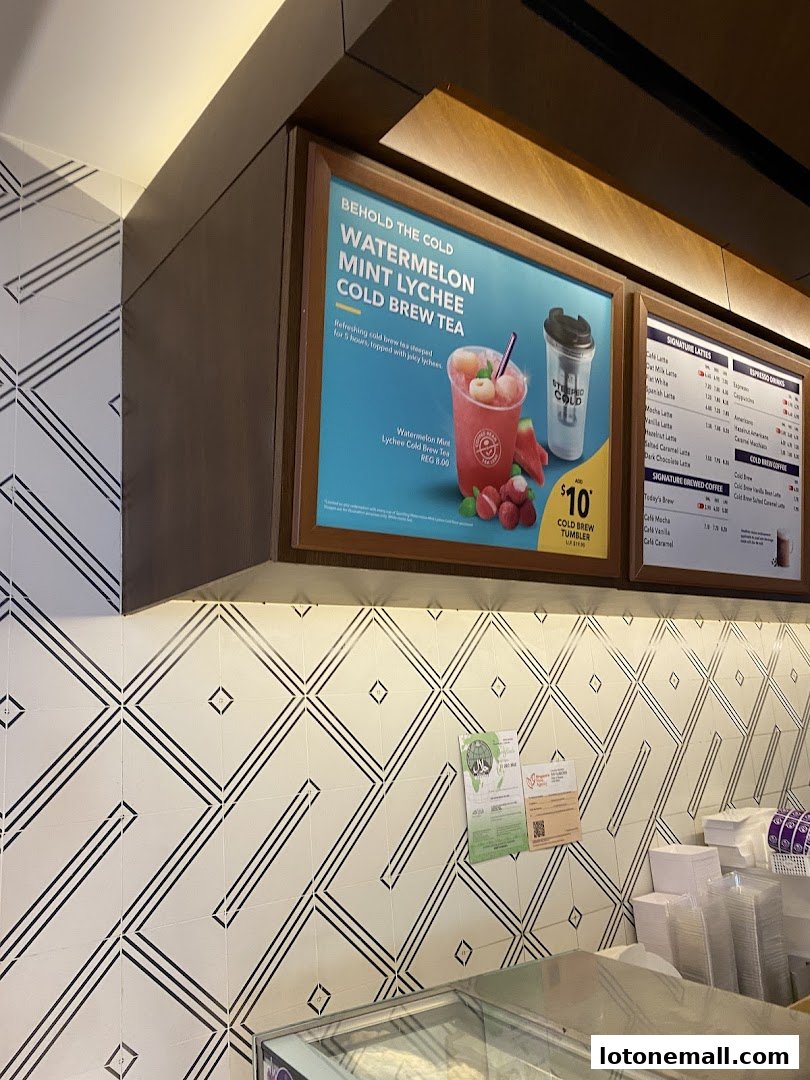 A menu board at The Coffee Bean & Tea Leaf featuring a Watermelon Mint Lychee Cold Brew Tea.