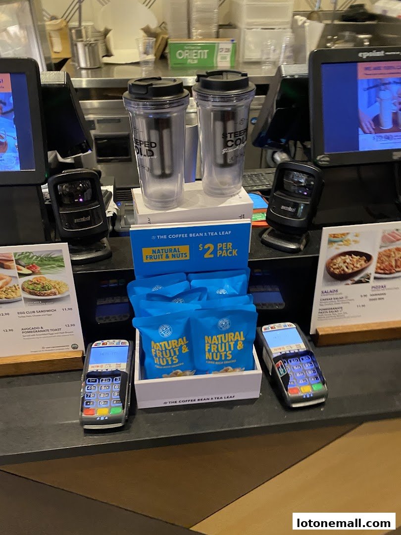 The Coffee Bean & Tea Leaf counter with payment terminals, snacks, and merchandise.