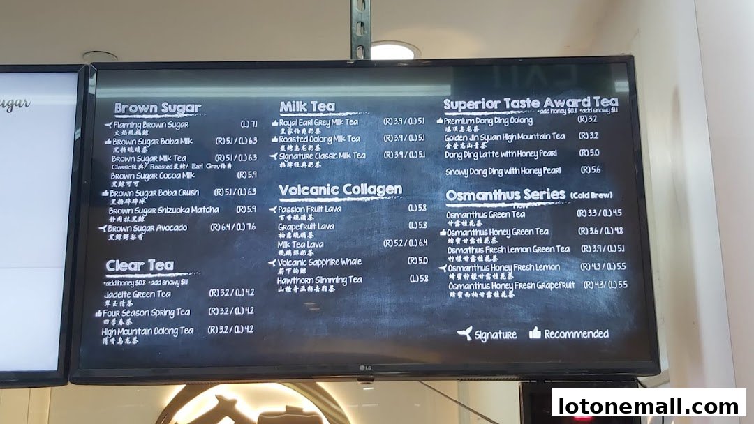 A digital menu board displaying various tea options with prices.