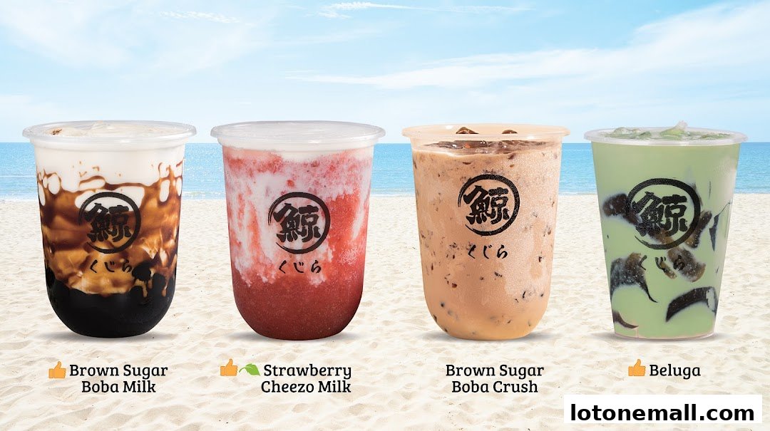 Four colorful bubble tea drinks displayed on a beach background.