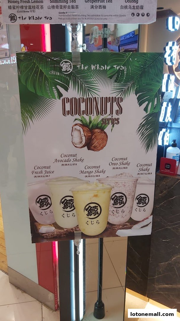A menu board for The Whale Tea featuring their Coconut Series drinks.