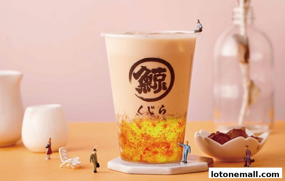 A close-up of a bubble tea with decorative miniature figures and a pink background.