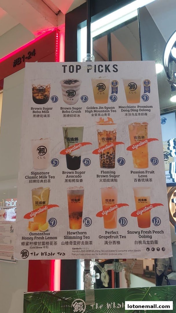 A menu board displaying 'Top Picks' from The Whale Tea with various drink options.