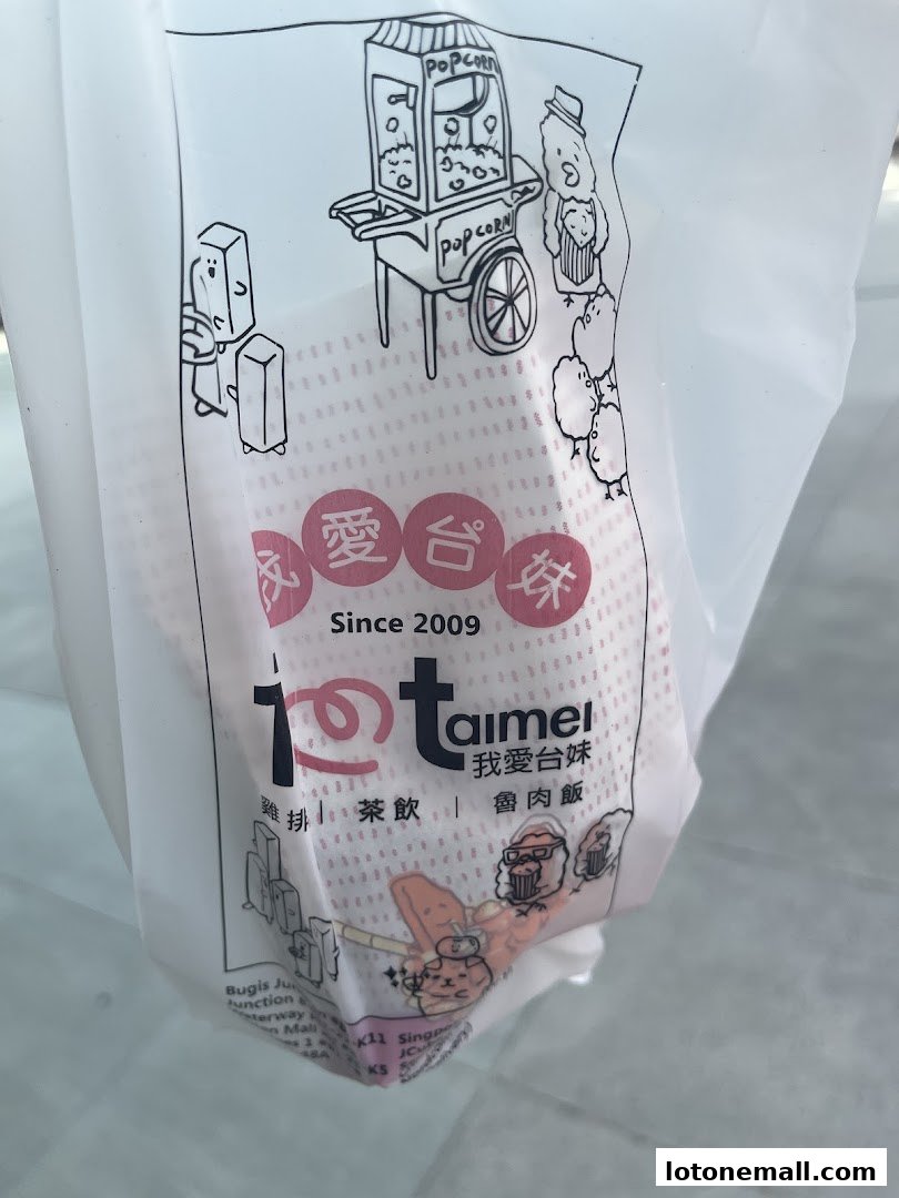 A white plastic bag with cartoon drawings and the shop's name 'taimei'.