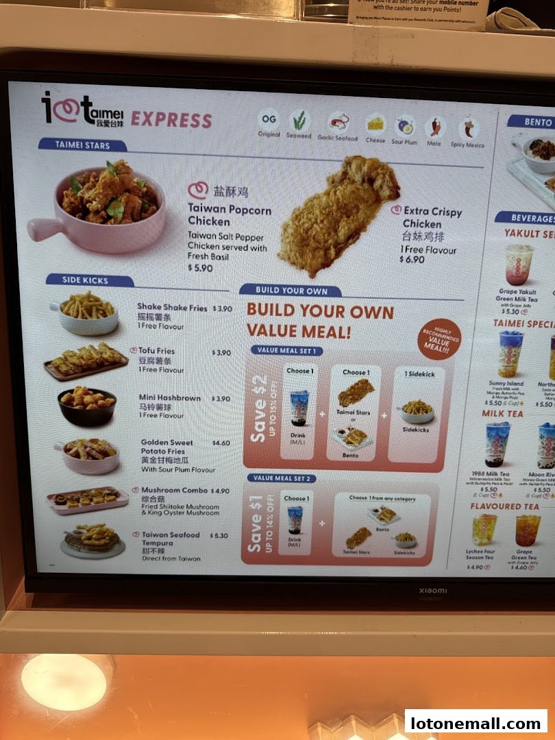A digital menu board displaying various Taiwanese fried chicken and side dishes, with value meal options.