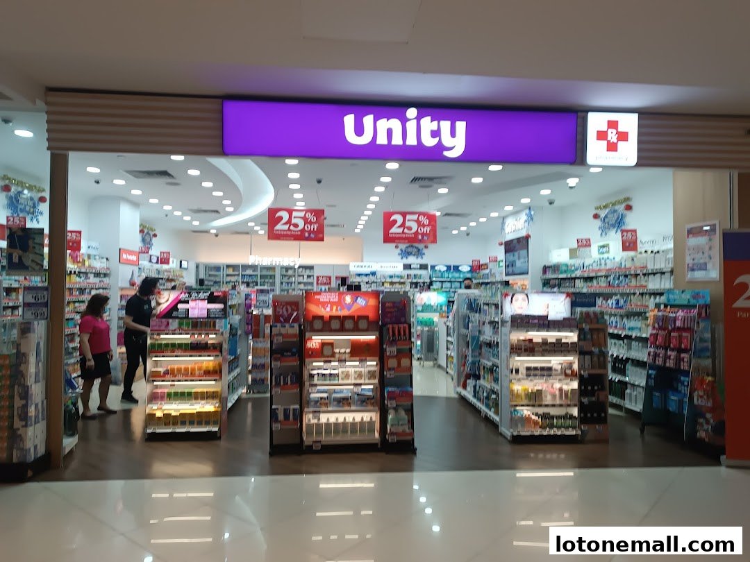 The entrance of a Unity pharmacy with shelves stocked with health and beauty products.