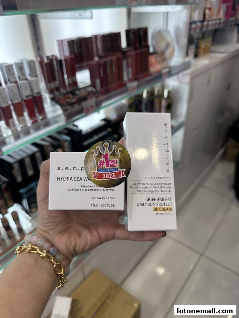 A hand holds two S.E.M.P. beauty products, a Hydra Sea Water and a BB Cream.