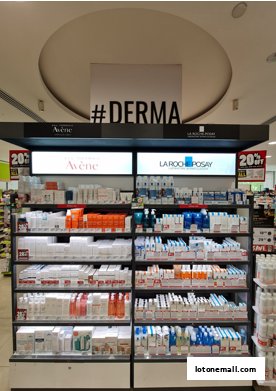 Shelves stocked with skincare products from Avene and La Roche-Posay, with a #DERMA sign above.