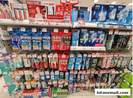 Shelves stocked with various oral hygiene products, including toothbrushes and toothpaste.