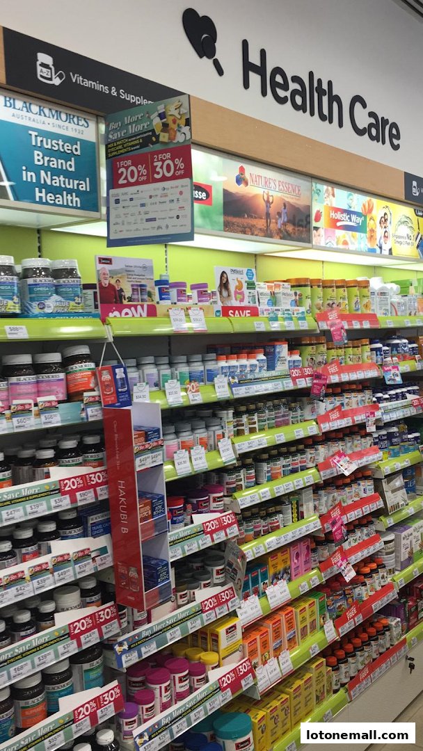 A wide selection of vitamins, supplements, and health products displayed on shelves in a retail store.