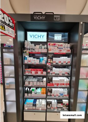 A display of Vichy skincare products with a 20% off sign.