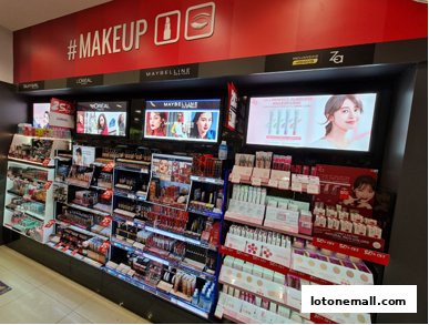 A wide display of makeup products from various brands, including L'Oreal and Maybelline.