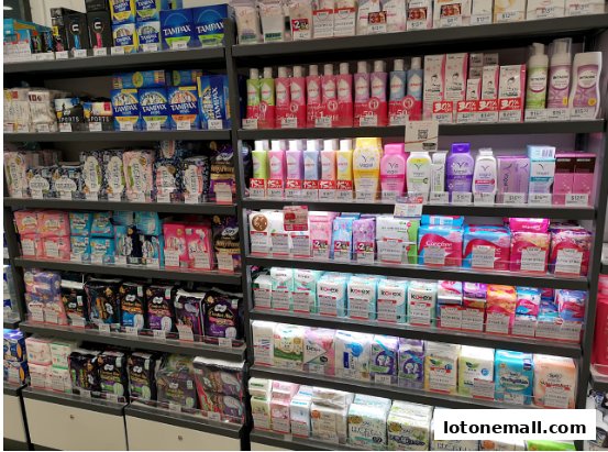 Shelves stocked with feminine hygiene products and personal care items.