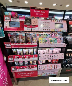 A display of Kiss Me Heroine Make cosmetics with various products and promotions.