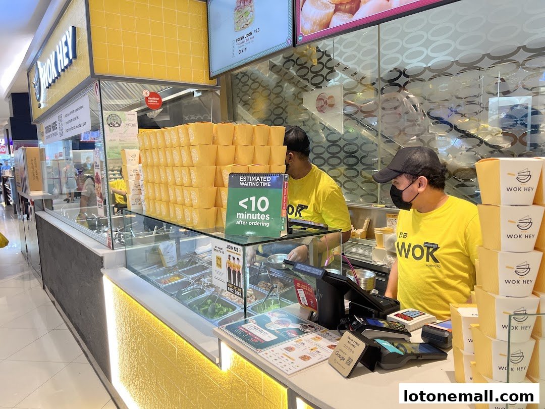 Wok Hey staff serving customers with fresh ingredients and a short waiting time.
