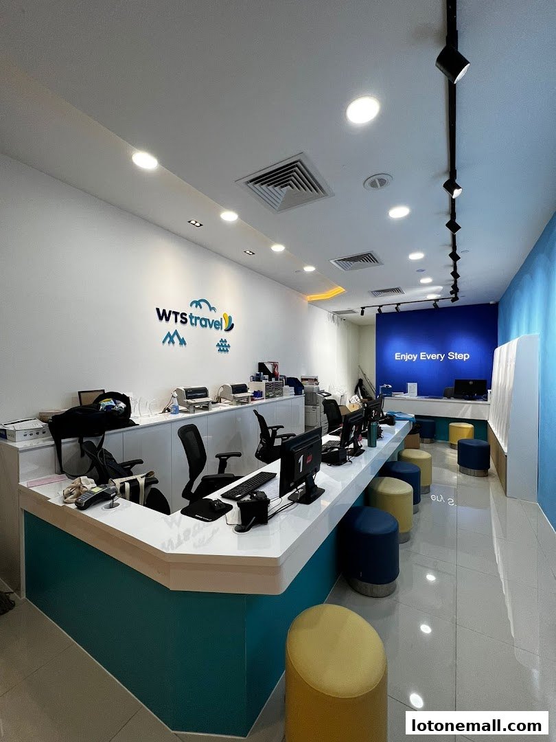 Interior view of WTS Travel & Tours Pte Ltd with a reception counter and seating.