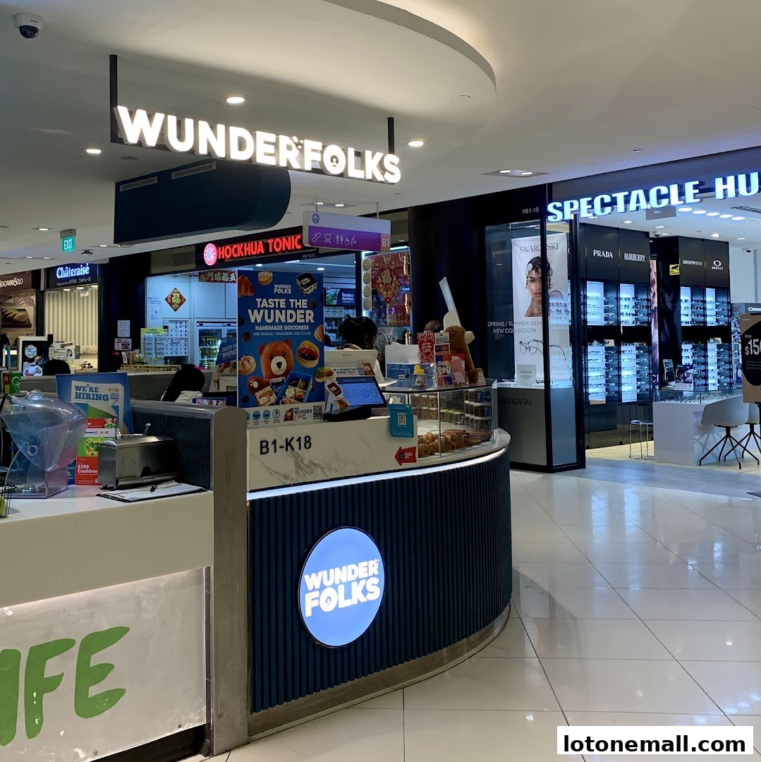 A view of the Wunderfolks Handmade Tarts shop with its signage and display counter.