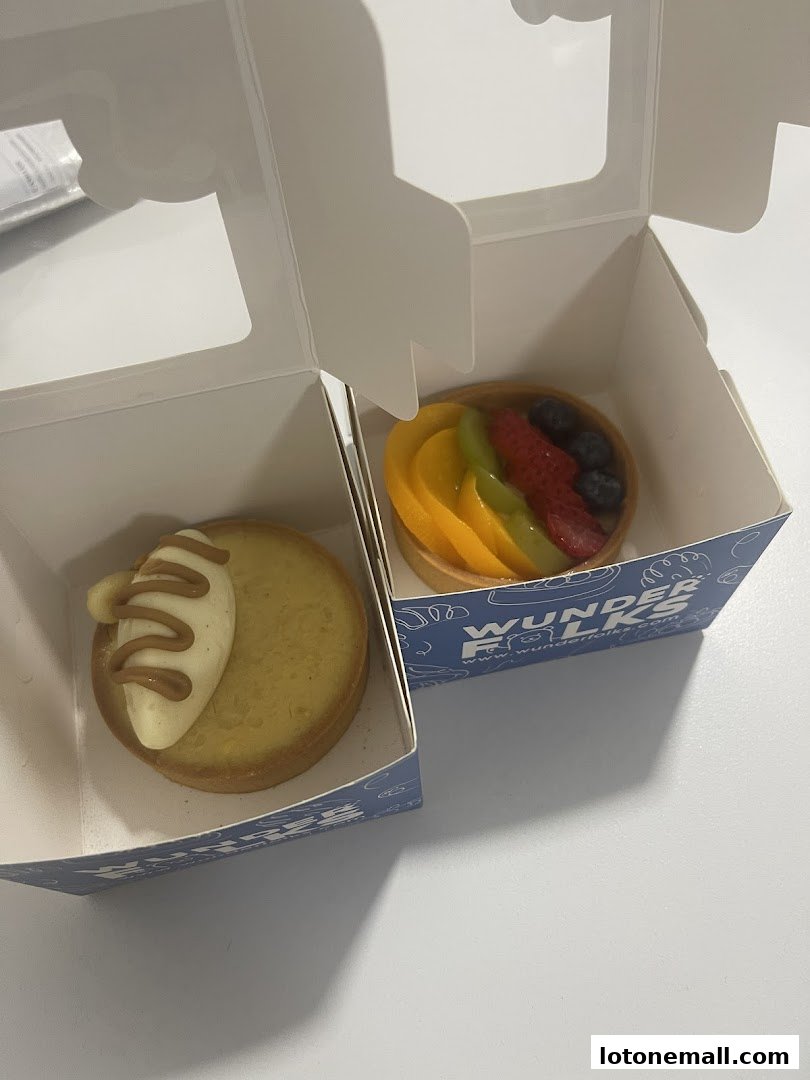 Two delicious tarts from Wunderfolks Handmade Tarts in their branded boxes.