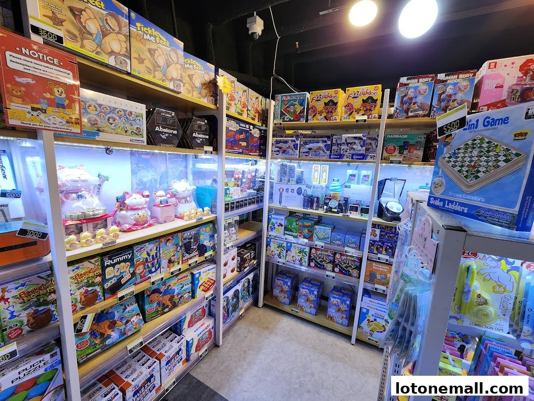 A brightly lit toy store interior with shelves stocked with board games and toys.