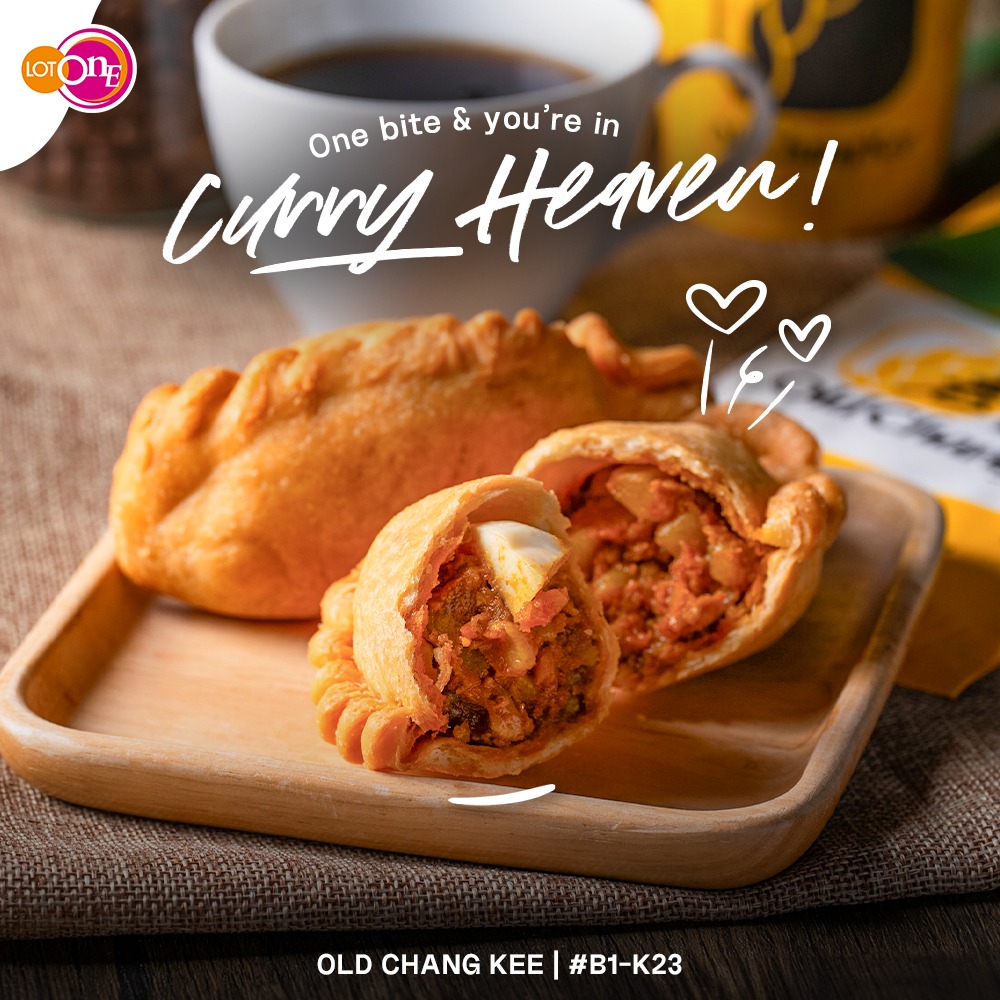A perfectly golden-brown Old Chang Kee curry puff, showcasing its crispy exterior and inviting filling.